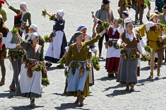 Maids waving garlands of flowers