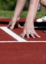 Runner at the starting position on a track