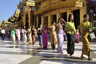 Women during a Buddhist ceremony at Shwedagon Pagoda