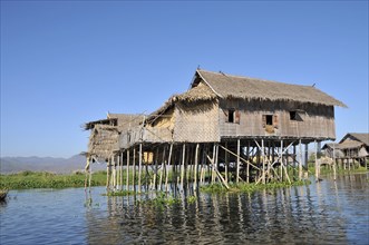 Simple traditional straw house on stilts