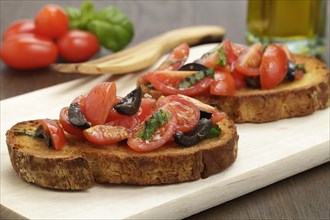 Bruschetta with tomatoes and black olives