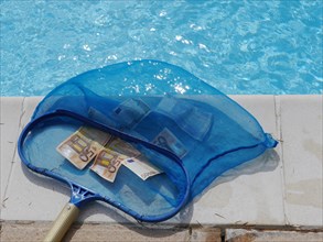 Dip net full of Euro banknotes at a swimming pool