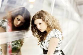 Woman and her mirror image