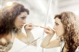 Woman and her mirror image