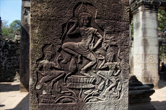 Stone relief with dancing girls in the temple complex of Bayon