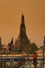 Wat Arun or 'Temple of Dawn' on the Chao Phraya River just after sunrise