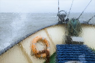 View through the wet window of the bow of the shrimp boat 'Columbus' from Pellworm island