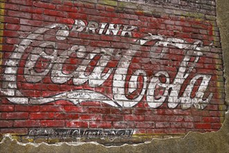Old Coca-Cola advertising on a brick wall