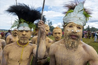 Members of a tribe in colourfully decorated costumes with face and body paint at the traditional sing-sing gathering
