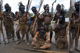Half-naked tribal warriors posing during the traditional Sing Sing in the highlands