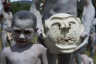 Boy from the tribe of the Mudmen during the traditional Sing Sing in the highlands
