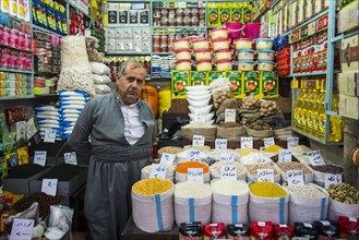 Vendor in his stall in the bazaar of Sulaymaniyah
