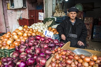 Vendor selling onions in the bazaar of Sulaymaniyah