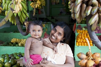 Female vendor holding her baby