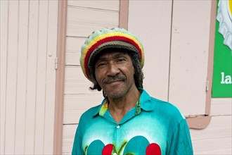 Smiling Creole man with a colourful hat