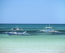 Two Bankas or outrigger boats on the sea