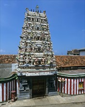 Gopuram or gate tower at the entrance to the Hindu temple of Ganeshan