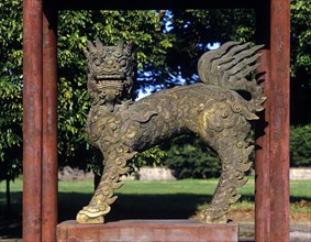 Bronze lion sculpture in the park of the Imperial Palace of Hoang Thanh