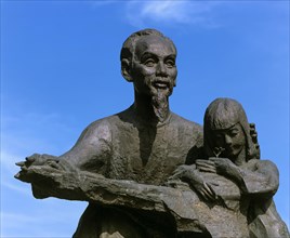 Statue of Ho Chi Minh or 'Uncle Ho' with a child