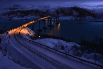 Bridge with fjord by moonlight