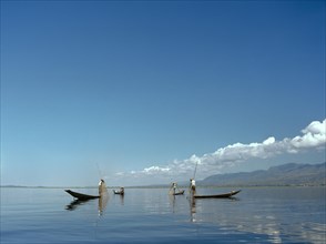 Leg rowers with creels on Inle Lake