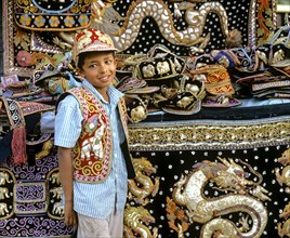 Boy with traditional textile art