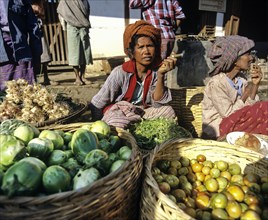 Women selling fruits and vegetables at a market