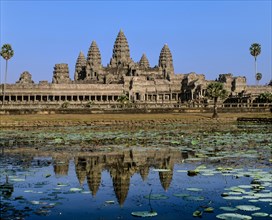 Temple of Angkor Wat reflected in a lotus pond