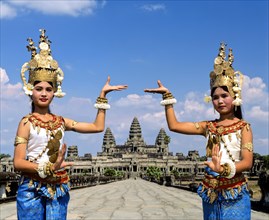 Temple dancers or apsaras on the western promenade in front of the temple of Angkor Wat