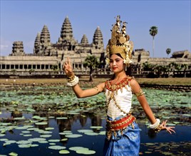 Temple dancer or apsara at the Lotus Pond in front of the temple of Angkor Wat