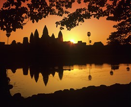 Main temple of Angkor Wat reflected in a pond