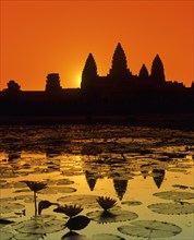 Main temple of Angkor Wat reflected in a lotus pond