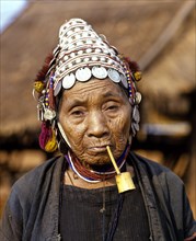Akha woman with a pipe