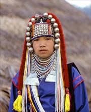 Akha girl with traditional clothing and headdress