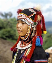 Akha girl with traditional clothing and headdress