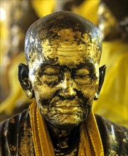 Gilded monk statue in the mountain temple of Wat Phra That Doi Tung