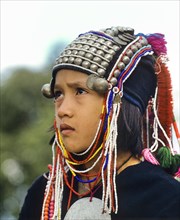 Akha girl with traditional clothing and headdress