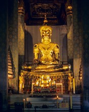 Golden Buddha statue in a temple in Ayutthaya