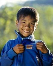 Boy with a Thailand sticker on his training jacket