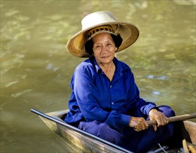 Elderly woman on a boat