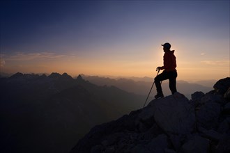 Mountaineer on Grosser Krottenkopf Mountain at dusk
