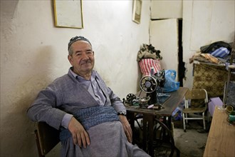 Tailor in a tailor store