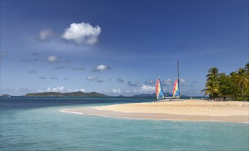 Headland with sailing boats on the Caribbean Sea