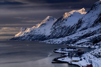 Fjord with small town in the evening light