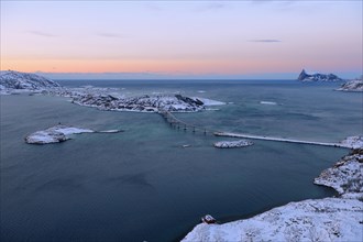 Fjord with islands and a bridge during the blue hour