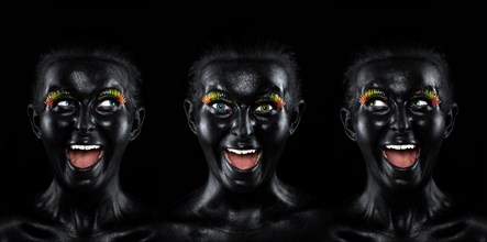Triple faces of a laughing young woman painted with black facepaint