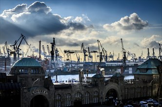 St. Pauli Landing Bridges in front of the Blohm + Voss shipyard with cranes