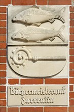 Fish reliefs on the facade of the mayor's office