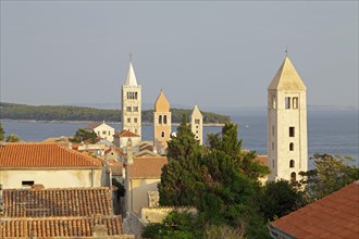 Four church steeples above the roofs of the historic town centre