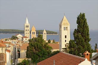 Four church steeples above the roofs of the historic town centre